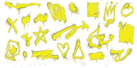Set of yellow graffiti spray paint elements with drips and street art shapes © mahedi