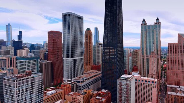 Hancock Center surrounded by urban skyscrapers, Chicago, Illinois. Urban cityscape composition captured from a high vantage point.