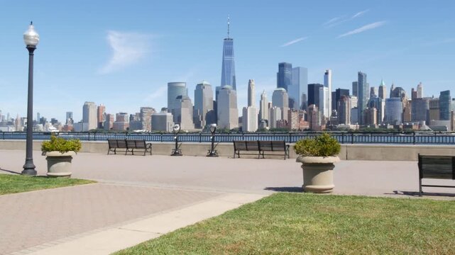 New York City Manhattan Downtown Financial District skyline, World Trade Center tower, cityscape from New Jersey Liberty state park, United States. Hudson river waterfront walkway, skyscraper building