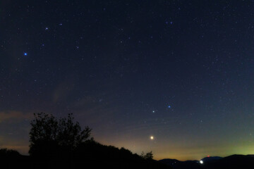 Fototapeta premium Constellations, landscape, Milky Way stars on a dark countryside skies.