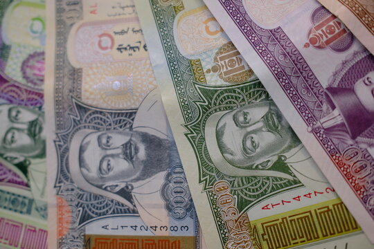 Pile of Mongolian t&ouml;gr&ouml;g (tugrik) banknotes, top view close up. Mongolian t&ouml;gr&ouml;g bills background