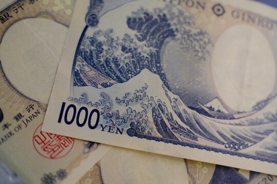 Japanese yen 1000 yen banknote close-up on dark marble background. Japanese 1000 yen bill on black marble surface, macro shot top view