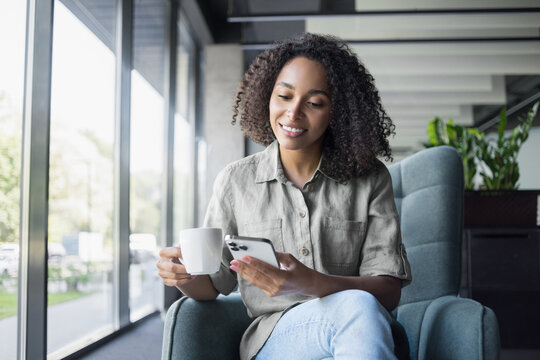 Businesswoman texting on mobile phone in modern office, Young student woman using smartphone at cafe. Online communication, business lifestyle, work or study connection, mobile apps, technology