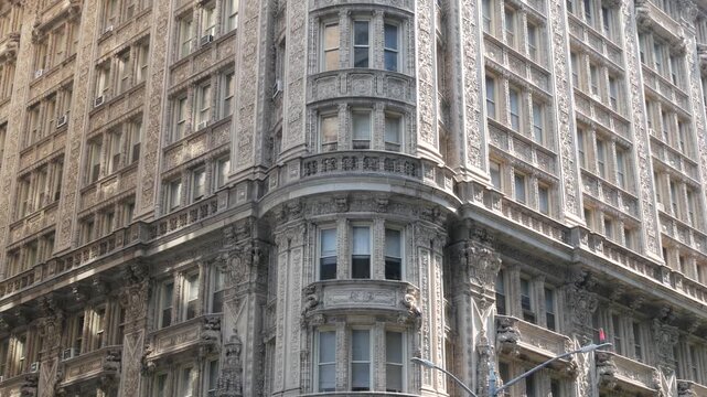 New York City Manhattan Midtown historic building 1909, facade architecture, United States of America. Real estate property on 7 seventh avenue. Classic style design landmark. Corner symmetry, windows