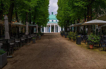 Naklejka premium Elegant Wandelhalle, also known as Promenade Hall or walking hall, with its spa architecture and Spring Square with outdoor dining cafe and restaurant