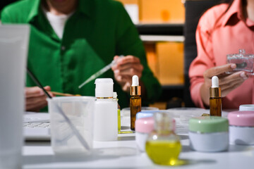 Fototapeta premium Woman making organic cosmetics with aloe in laboratory