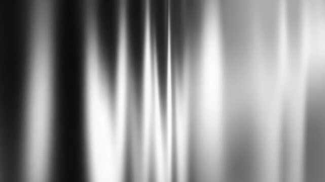 Abstract black and white blurred gradient background with smooth flowing lines and soft light effects. Modern minimalistic texture perfect for creative design and digital art projects