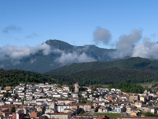 Obraz premium Olot town cityscape under Pyrenees mountains in Catalonia
