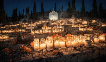 Candlelit hillside cemetery at night with marigolds and chapel during All Souls Day