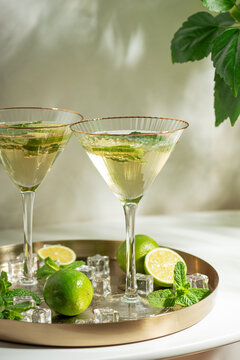 Refreshing summer cocktails with mint and lime on tray