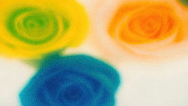 Brightly colored roses in green, yellow, and orange on a light surface showing a vibrant floral arrangement