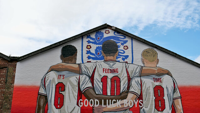 Manchester, England, UK - 18 June 2026: England football mural on brick wall, three lions soccer players graffiti close up, sport national team support art in UK