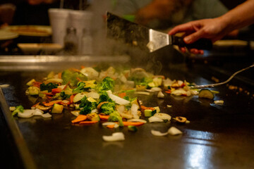 Fototapeta premium Grilling vegetables at a Hibachi Steak House