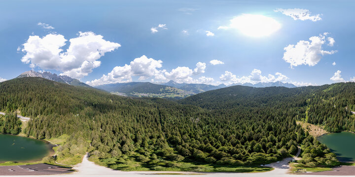 Aerial 360 view of Lago Santa Anna near Danta - Cadore Dolomites mountains landscape