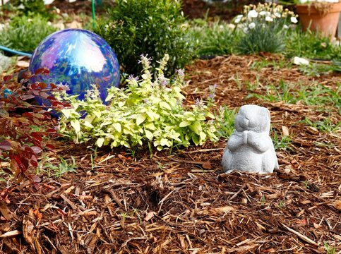 Bunny statue and blue globe garden decorations
