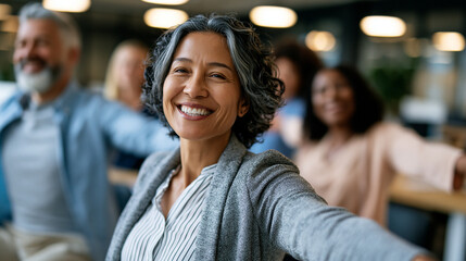 Fototapeta premium A wide shot of a group of adults stretching softly their arms together during a calm bright office exercise break office stretch open faces bright office daylight workspace