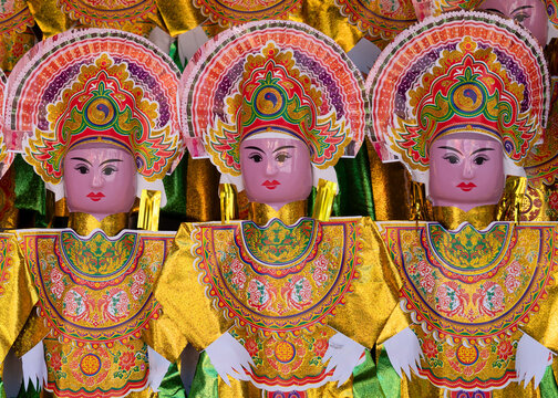 Vietnam, colourful human paper representation in a temple