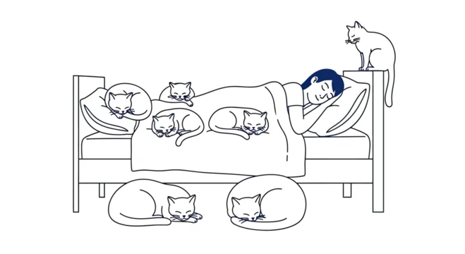 Woman sleeping in bed surrounded by multiple pet cats.