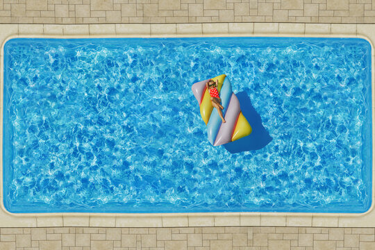 Child girl in swimming pool. Having fun on vacation at the hotel pool. Colorful vacation concept.