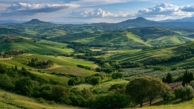 Landscape of rolling green hills under dramatic cloudy sky in countryside