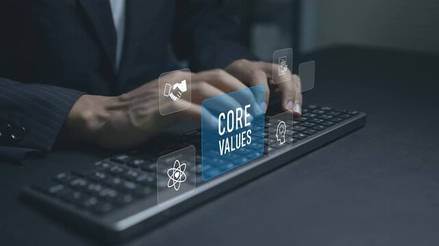 Digital core values and corporate culture concept. Person typing keyboard with vision and communication icons, business ethics, company values and workplace engagement.
