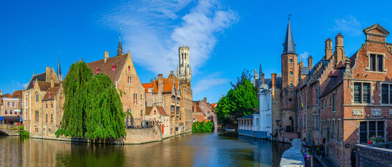 Obraz premium Panorama Bruges, Brugge old town panoramic view, Rosary Quay embankment, Bourgondisch Cruyce, Belfort Belfry tower, De groote Hollander Huidevettershuis, Dijver water canal, Flemish Region, Belgium