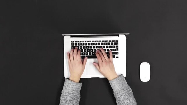 Top View of Hands Typing on Laptop Keyboard, Flatlay of Desk with Laptop and Wireless Mouse, Office Worker Typing and Closing Laptop Lid, Minimalist Workspace with Person Working on Computer