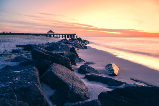 Long exposure photograph of the waterfront at Buckroe Beach in Hampton Virginia on a peaceful morning around sunrise