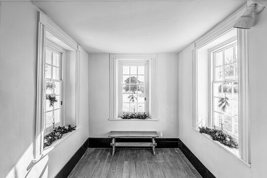 Interior of early American estate with white walls, Bacon's Castle Virginia