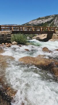 top of Nevada Fall, where the Merced River rushes across smooth granite before plunging into the canyon below