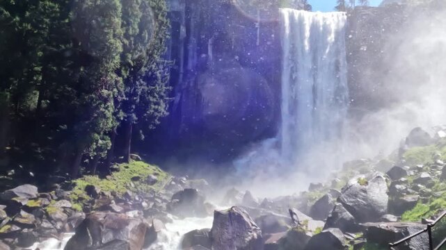 Vernal Fall waterfall in Yosemite National Park, California, featuring rushing water, granite cliffs, forest scenery, and pristine wilderness landscapes