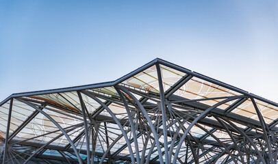 a modern metal and glass roof structure © michal812