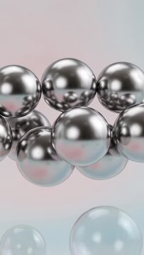 Vertical video: Pulling camera back revealing sphere cluster lower row and bubbles on pastel