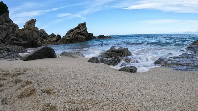 Sea waves rolling onto beach at Zambrone, Costa degli Dei, Calabria, Italy
