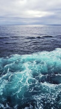Cruise ship sailing through the open ocean with calm blue waters, horizon views, and peaceful maritime travel scenery.