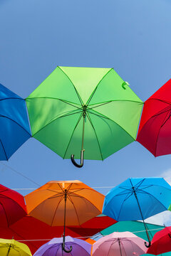 Vibrant display of colorful hanging umbrellas