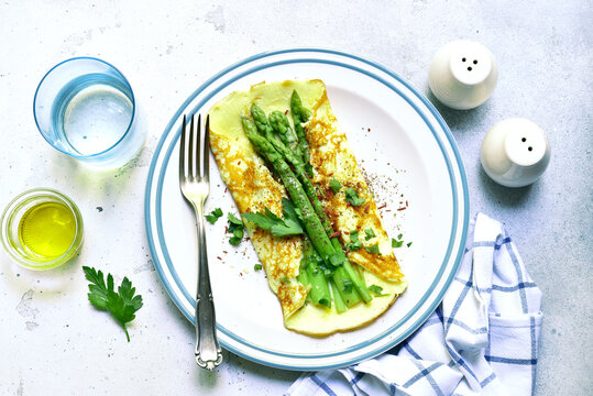 Spring omelette with green asparagus. Top view with copy space.