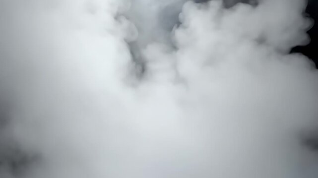 Abstract composition of blurry white and gray shapes resembling smoke or clouds