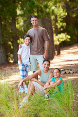 Fototapeta premium Holiday, parents or children in nature with portrait, bonding together or connection on summer vacation. Support, siblings or family with love, happy moment or healthy relationship on outdoor getaway