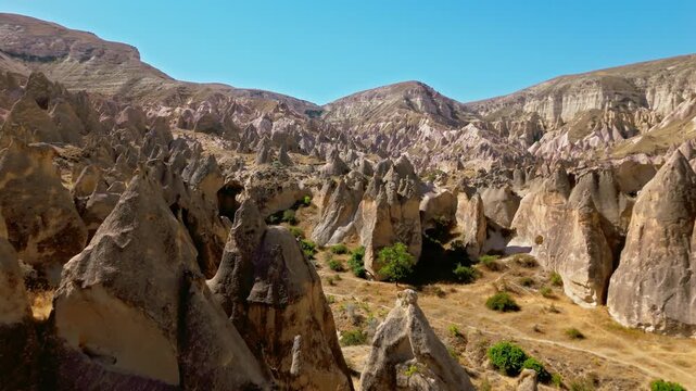 Drone view of Zelve Open Air Museum, Cappadocia, Turkey. Weathered cliffs, carved rock shelters and dry terrain highlight the site&rsquo;s ancient landscape.