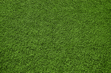 Artificial green grass texture background. Top view of synthetic sports turf lawn. Clean field carpet pattern © Gereish