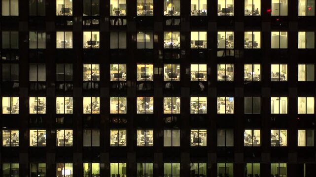 TOKYO, JAPAN : Close up time lapse shot of office building window at night. Job, work, company, corporate and business people concept video.