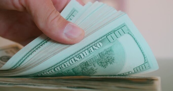 Business Wealth: Stacking 100 USD Banknotes
