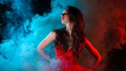 Fototapeta premium Woman in Red Dress Surrounded by Blue and Red Smoke