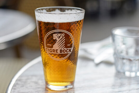 DIJON, FRANCE &ndash; APRIL 29, 2026:  Glass of Tigre Bock, a beer from the Kronenbourg group, the biggest french beer brand, headquarters located in Strasbourg, selective focus