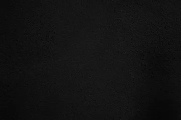  Textura de pared grunge negra, fondo superficial oscuro y rugoso. Superficie de pared oscura, rugosa y granulada con textura de ruido sutil. Fondo versátil para diseño editorial y de carteles. © C.Castilla