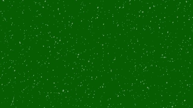 Real snowflakes falling over dark night background, slow motion winter snowfall effect with glitter particles, bokeh lights and christmas holiday atmosphere overlay green screen background, 4k video