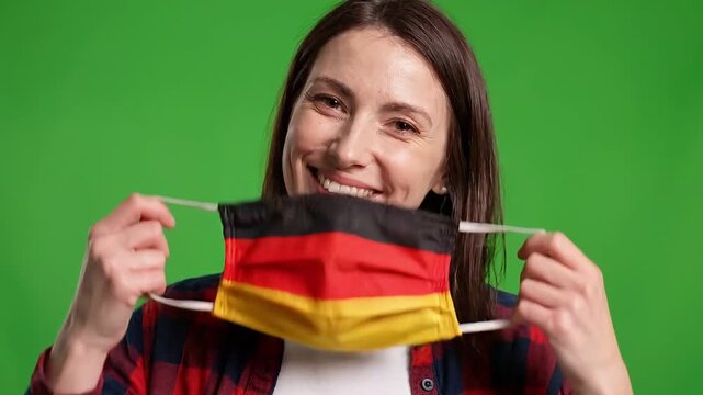 Woman wearing a face mask with the german flag pattern