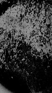 Vertical reel Seamless looping overlay of vintage film grain. High quality 4k footage