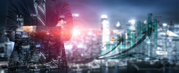 A businessman stands confidently with crossed arms in front of a vibrant city skyline, symbolizing success and growth with an overlay of dynamic financial charts. Scalp © InfiniteFlow